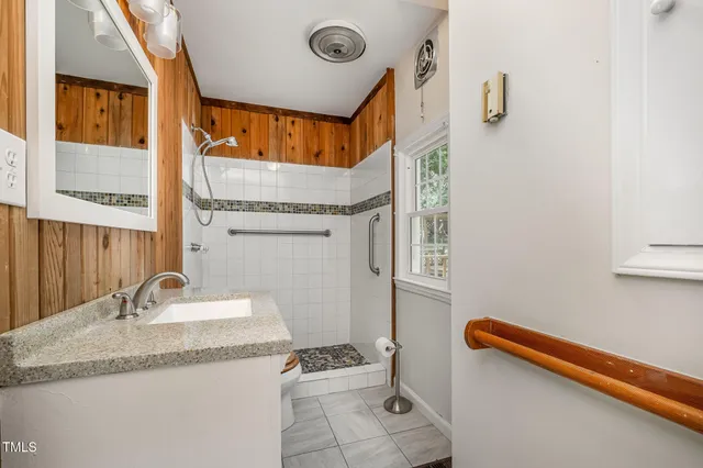 a view of a house with backyard and deck