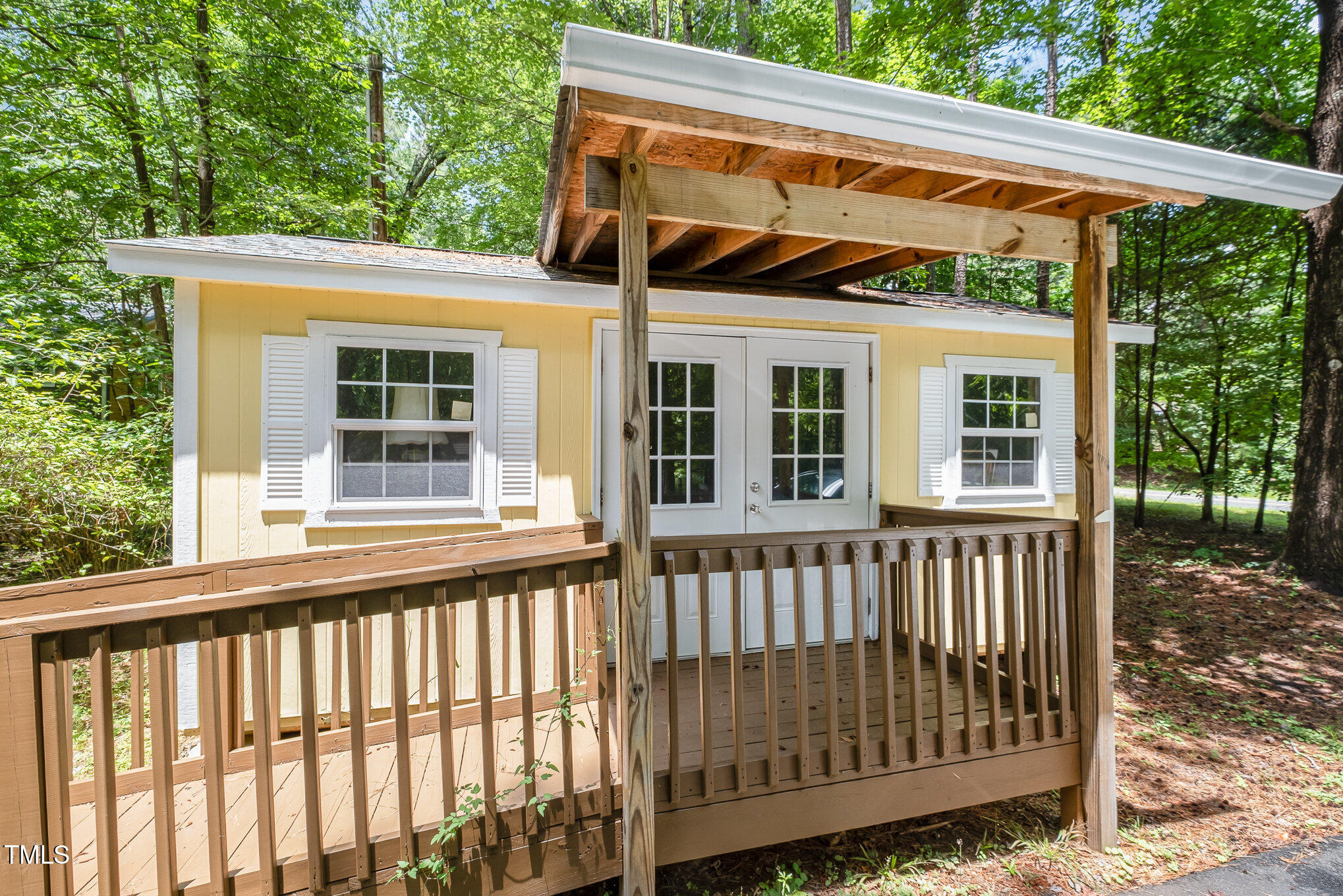 420 Lipscomb Grove Church Road Hillsborough, NC 27278 - Photo 23 of 27 a view of a wooden house with a large window
