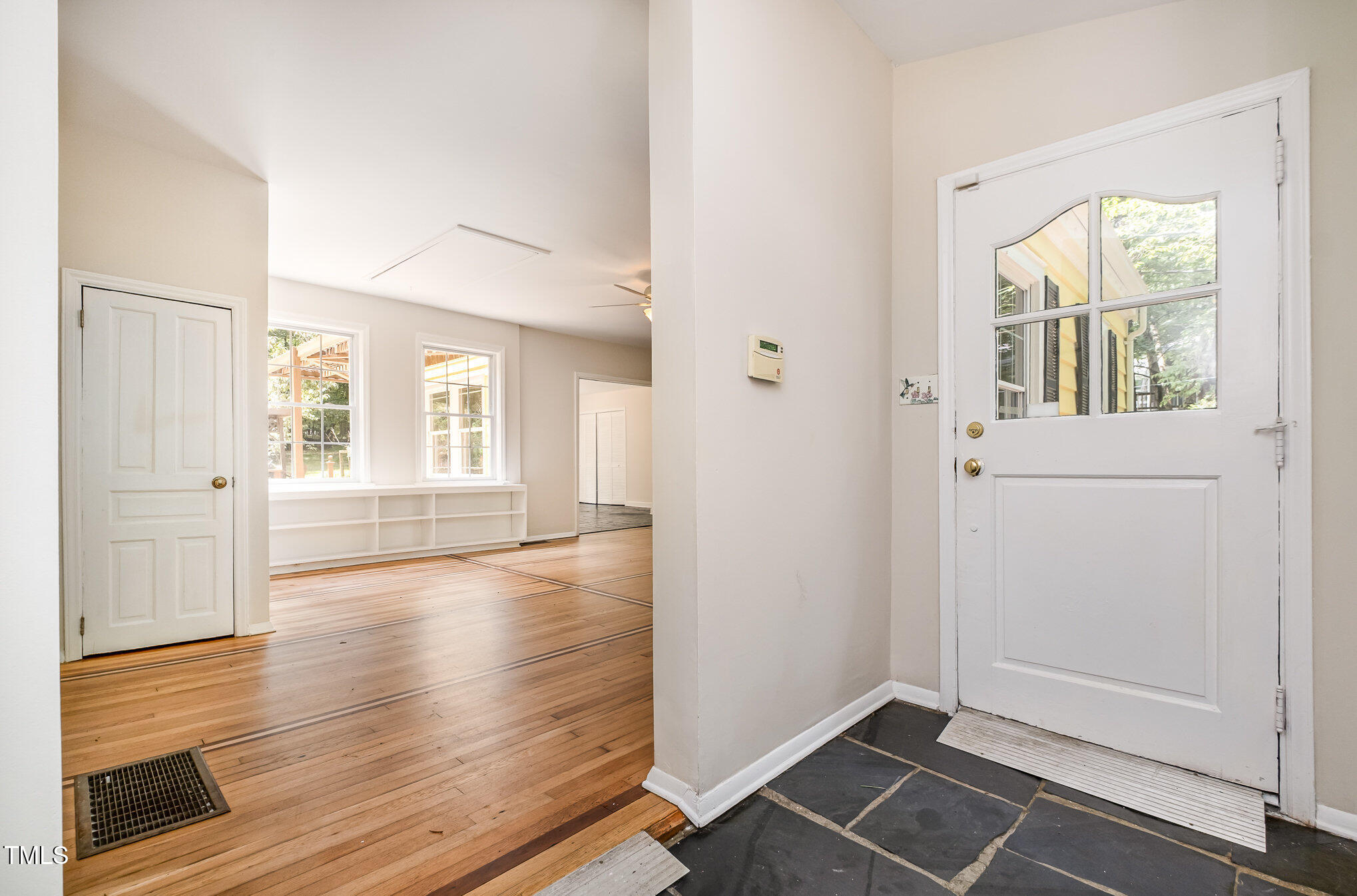420 Lipscomb Grove Church Road Hillsborough, NC 27278 - Photo 4 of 27 wooden floor in an empty room with a window