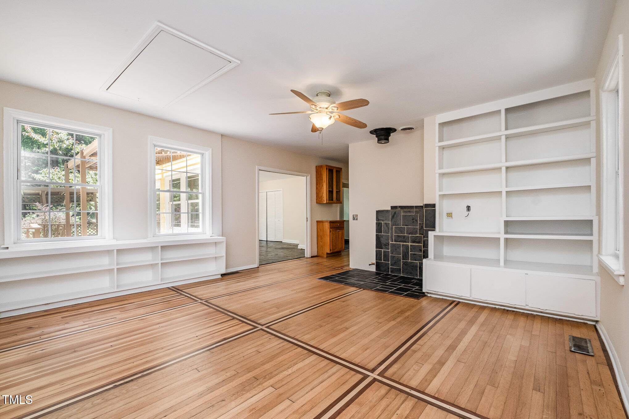 420 Lipscomb Grove Church Road Hillsborough, NC 27278 - Photo 5 of 27 a view of empty room with wooden floor and fan