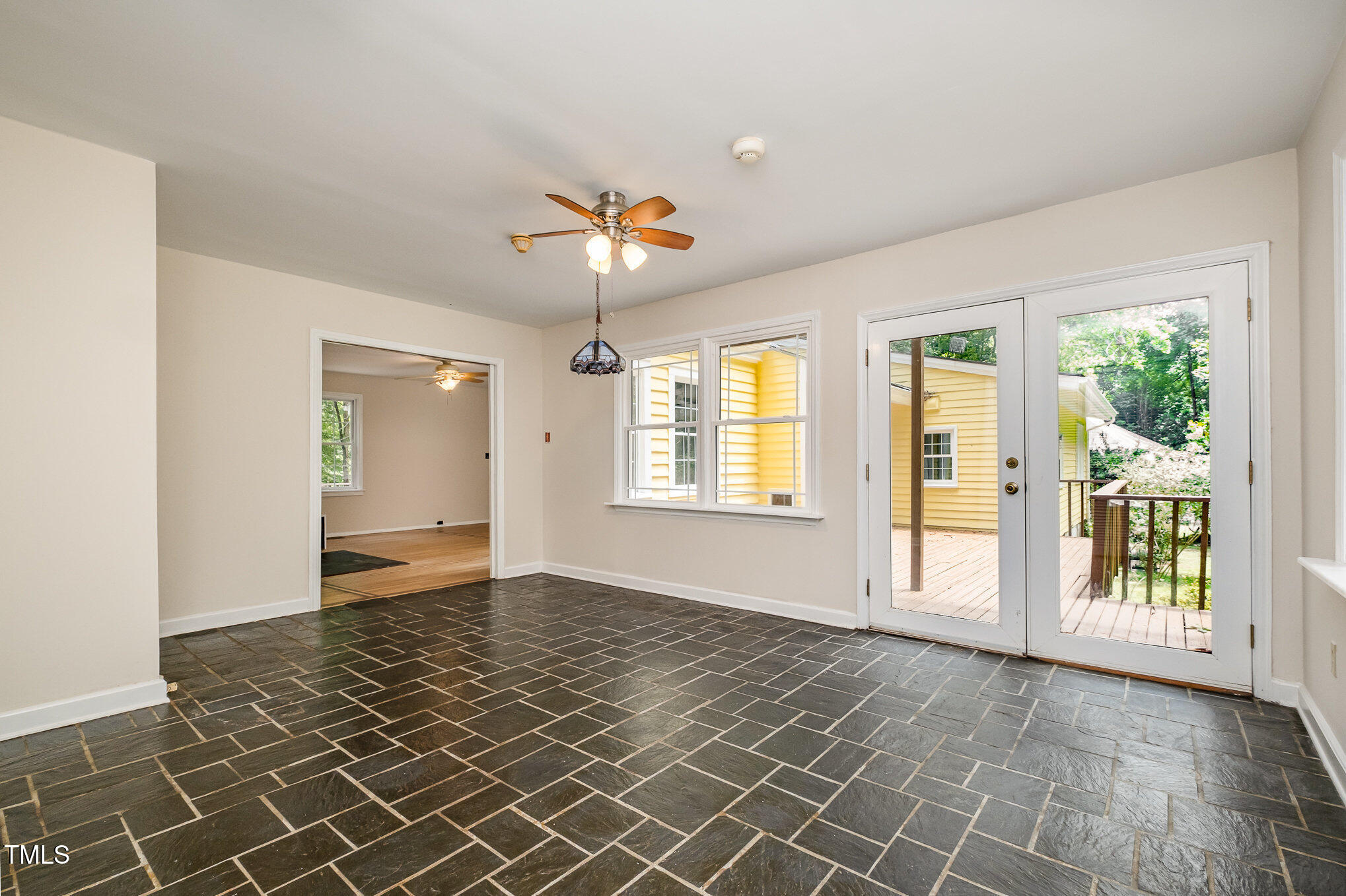 420 Lipscomb Grove Church Road Hillsborough, NC 27278 - Photo 10 of 27 an empty room with windows and chandelier