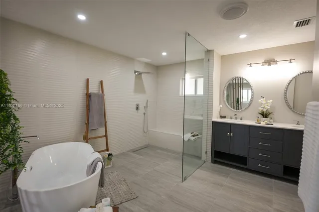 a bathroom with a double vanity sink and a mirror