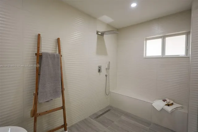 a view of a hallway with seating area