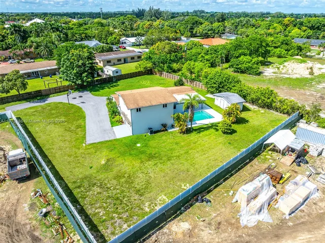 a view of an outdoor space pool patio and outdoor seating