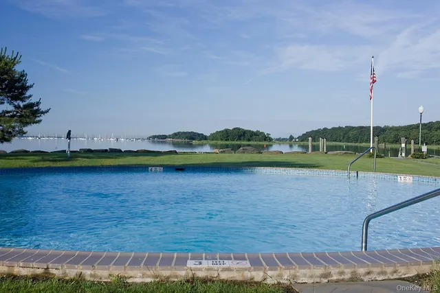 a view of a lake with houses in the background