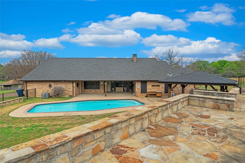 5840 Crystal Drive Midlothian, TX 76065 - Photo 25 of 36 a view of a house with pool and a yard
