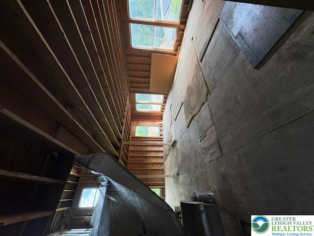 581 Mauch Chunk Road Palmerton, PA 18071 - Photo 17 of 27 Exposed wood framing and subfloors highlight this unfinished space ready for customization.