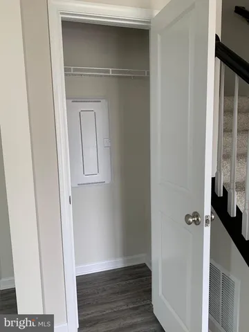 a view of front door with wooden floor