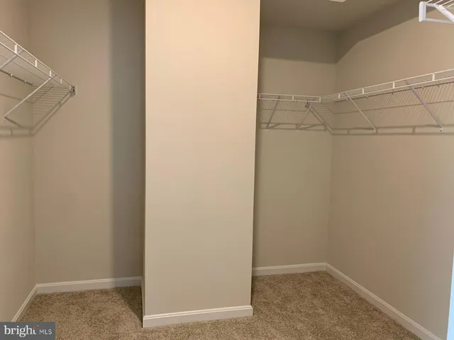 a view of a room with racks on the wall