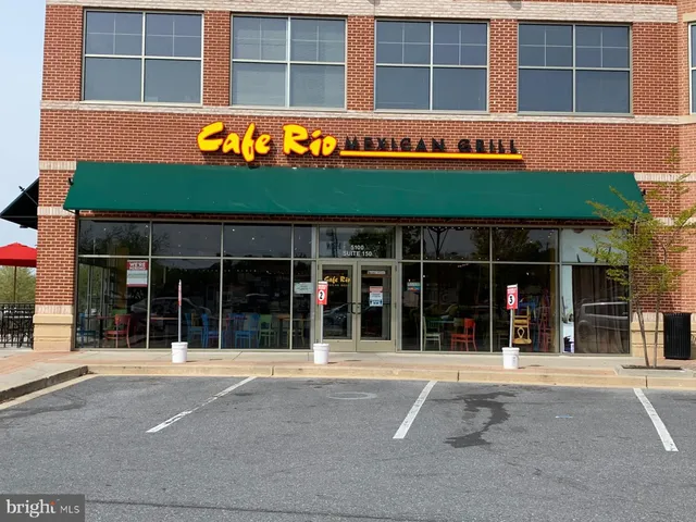 front view of a building with a potted plant