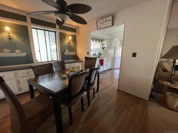 a view of a dining room with furniture and window