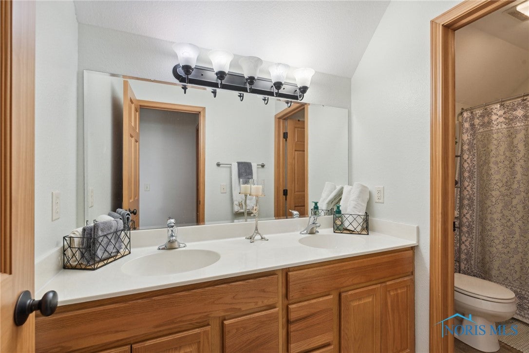 166 Lawai Road Oregon, OH 43616 - Photo 23 of 48 This upper level full bath is shared by 3 bedrooms easily with a dual vanity that is separate from toilet and shower. My kids did not fight in the a.m.