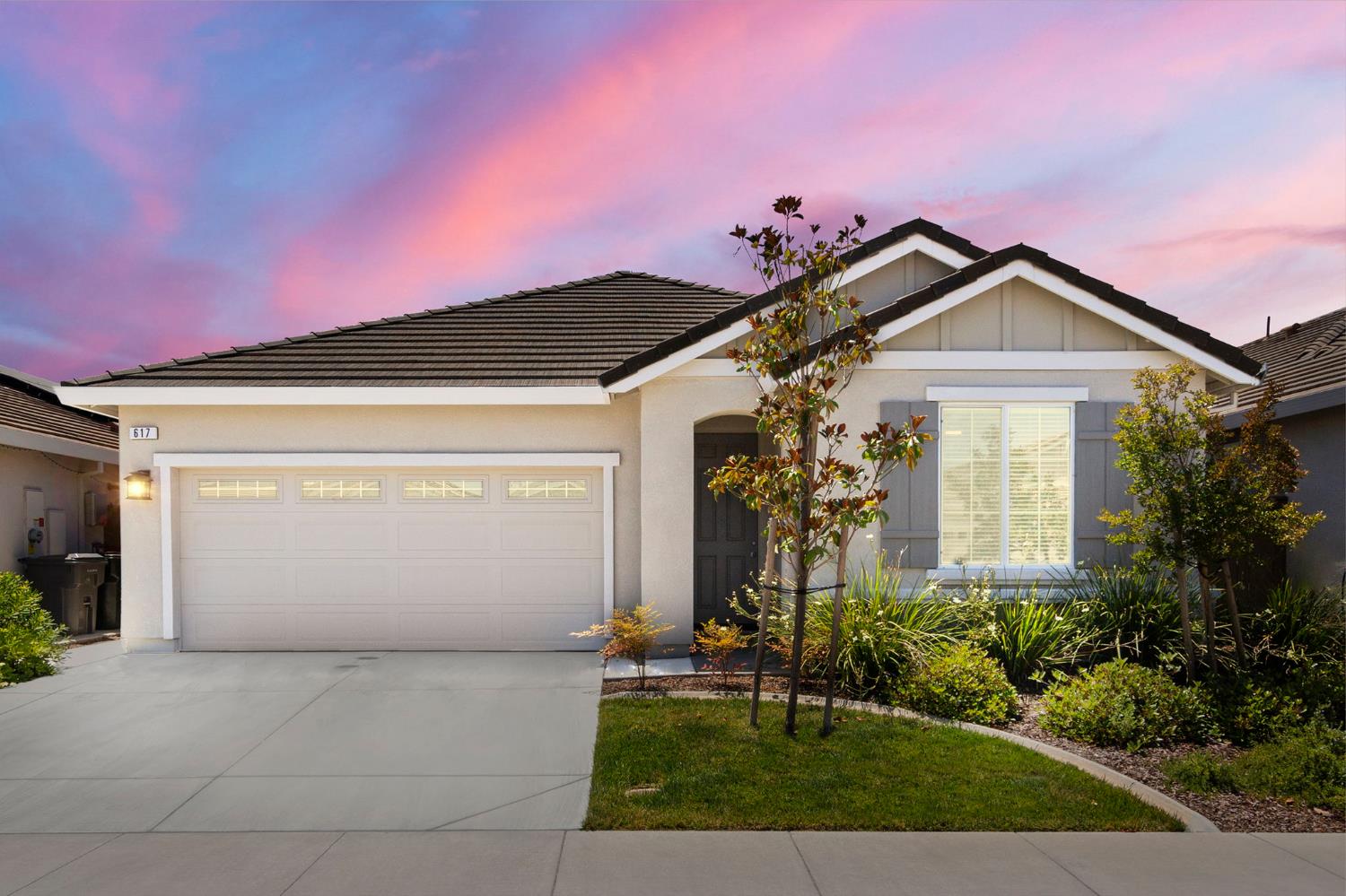 617 Sea Cliff Road Roseville, CA 95747 - Photo 1 of 1 a front view of a house with a yard and garage