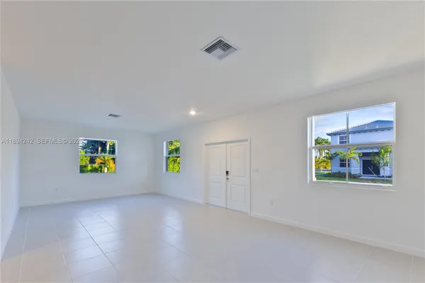 a view of a hallway with staircase