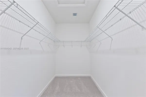 a bathroom with a shower and a sink