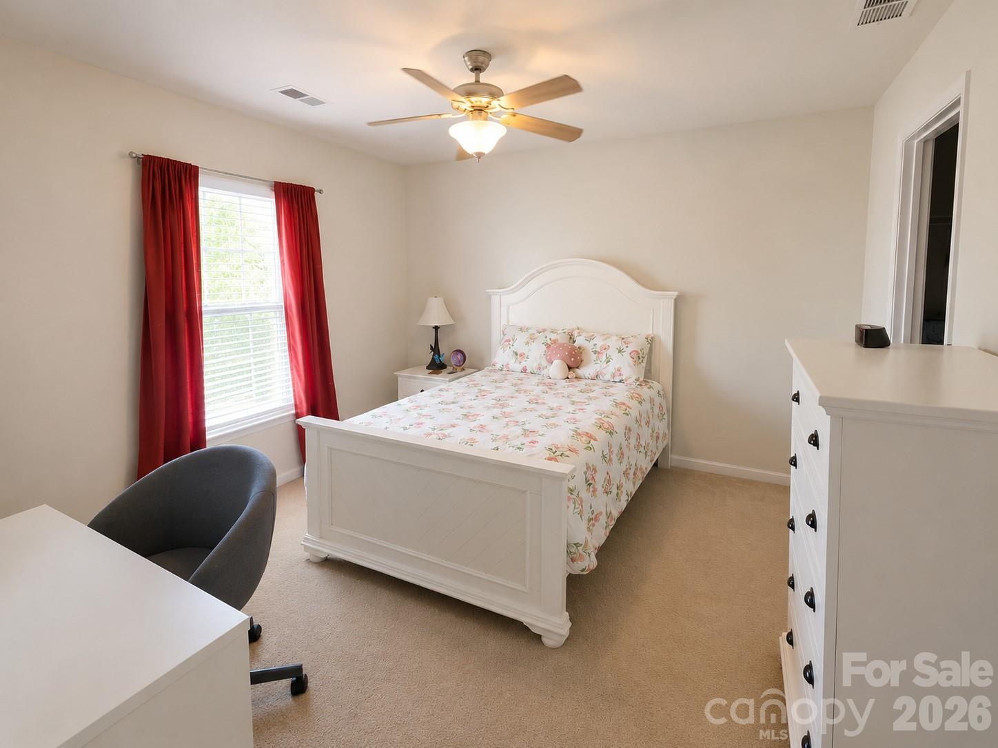 8006 Fine Robe Drive Indian Trail, NC 28079 - Photo 30 of 36 a bedroom with a bed and a chandelier