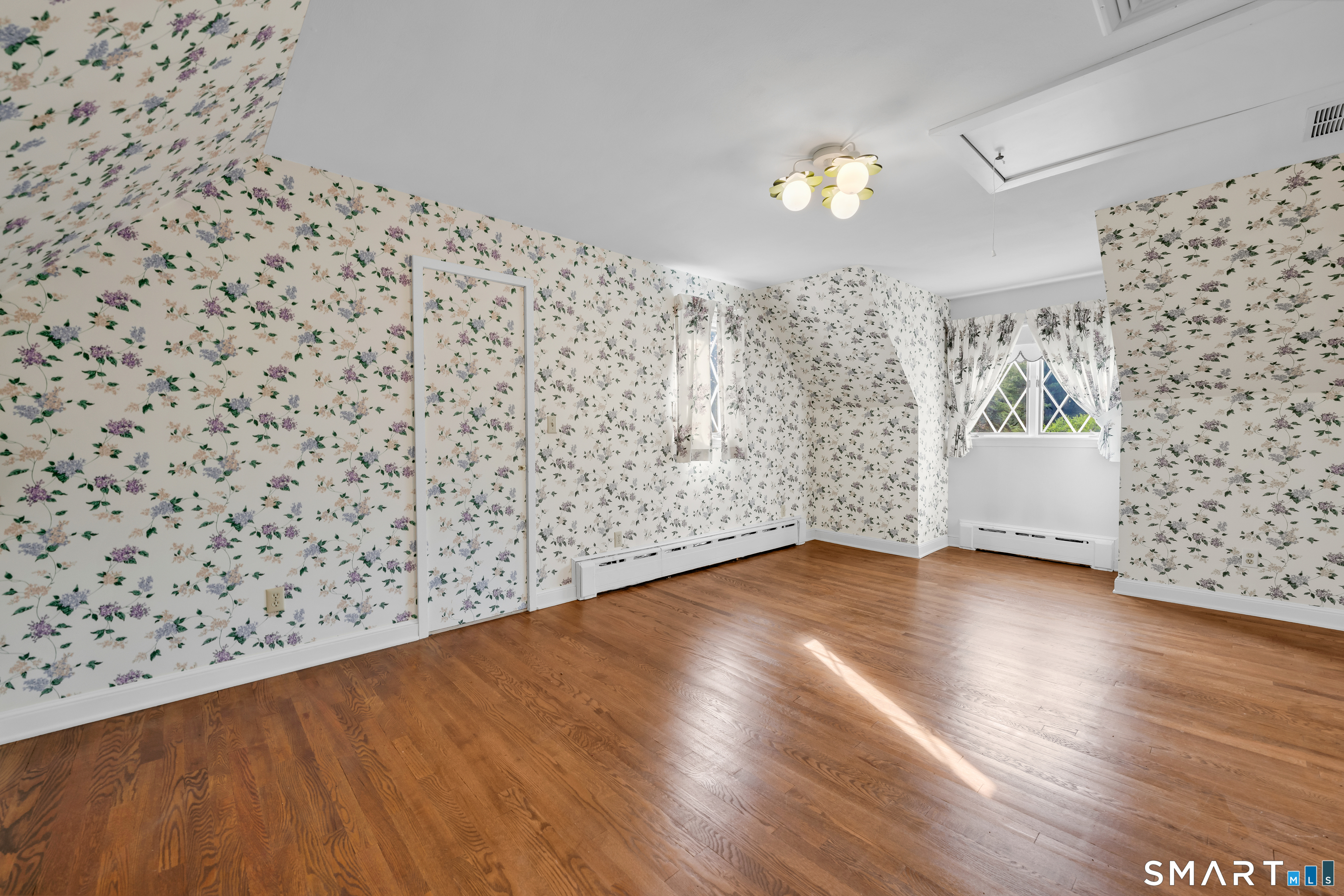 232 Maybrook Road Waterbury, CT 06708 - Photo 28 of 38 wooden floor in an empty room with a window