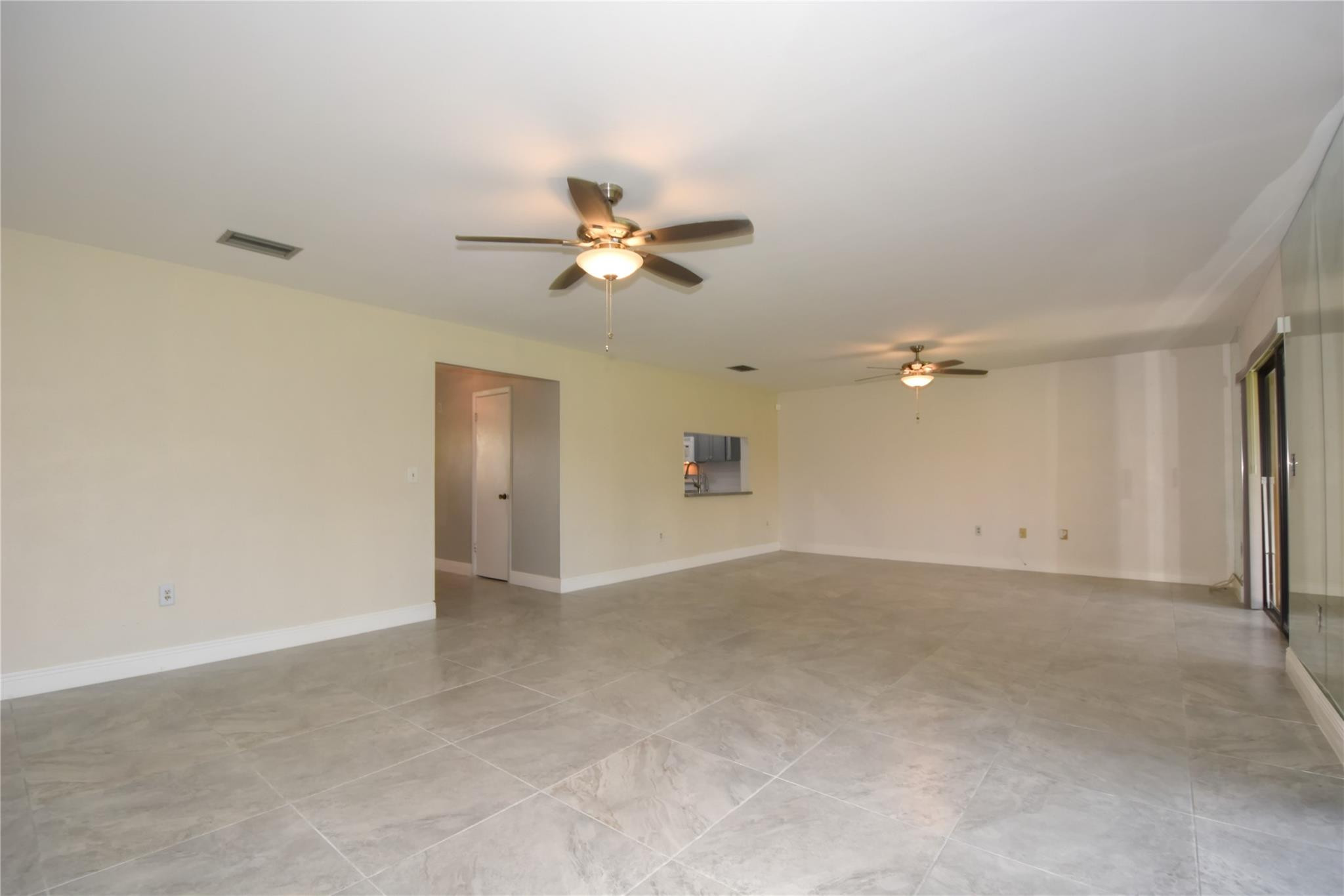 5467 Gate Lake Road, Unit 5467 Tamarac, FL 33319 - Photo 17 of 57 Living to Family Room View