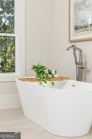 a bathroom with a double vanity sink mirror and
