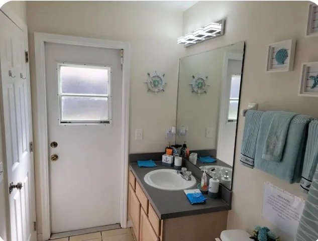 a bathroom with a sink and a mirror