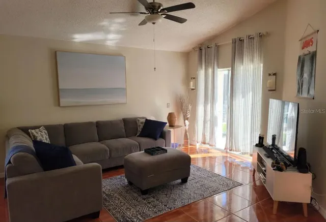 a living room with furniture and a window