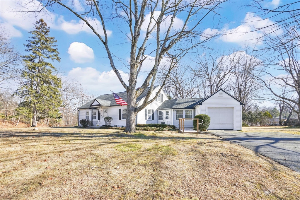 865 South Branch Parkway Springfield, MA 01118 - Photo 2 of 35 a house that has a tree in front of it