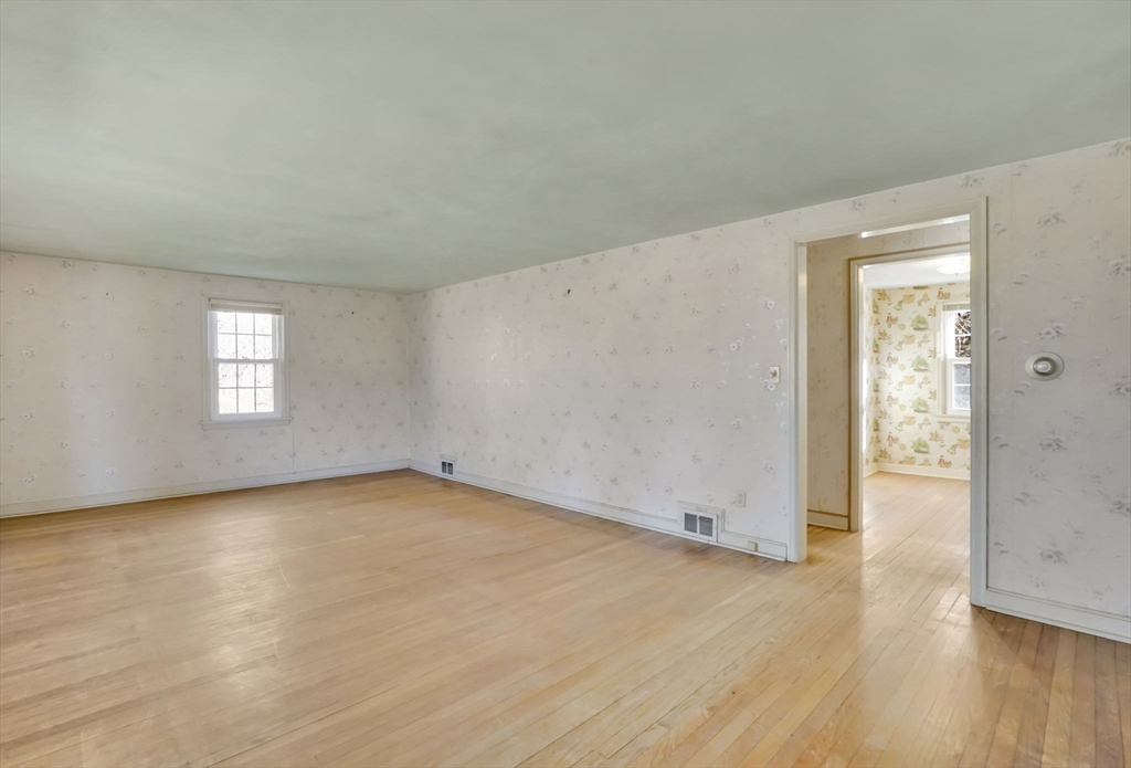 865 South Branch Parkway Springfield, MA 01118 - Photo 21 of 35 an empty room with wooden floor and windows