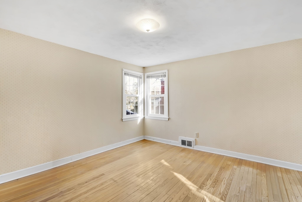 865 South Branch Parkway Springfield, MA 01118 - Photo 24 of 35 an empty room with wooden floor and windows