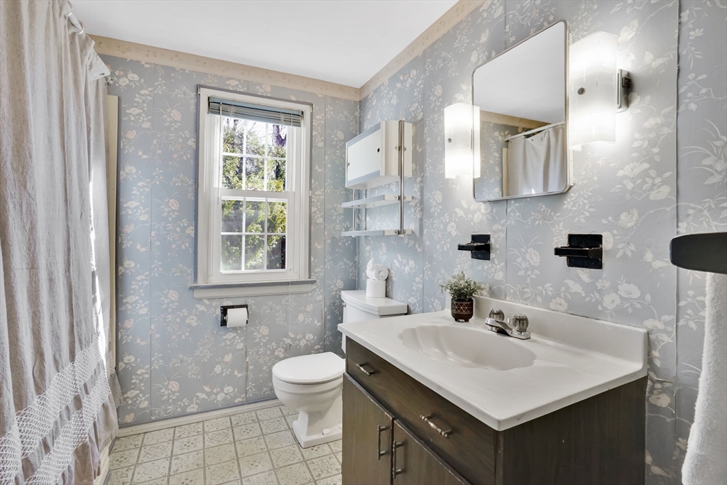 865 South Branch Parkway Springfield, MA 01118 - Photo 25 of 35 a bathroom with a sink toilet a mirror and shower