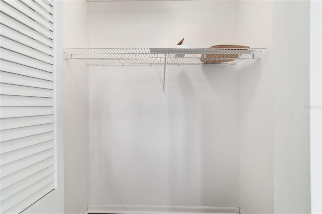 9460 Southwest 84th Terrace, Unit E Ocala, FL 34481 - Photo 19 of 21 a view of small space with racks on the wall