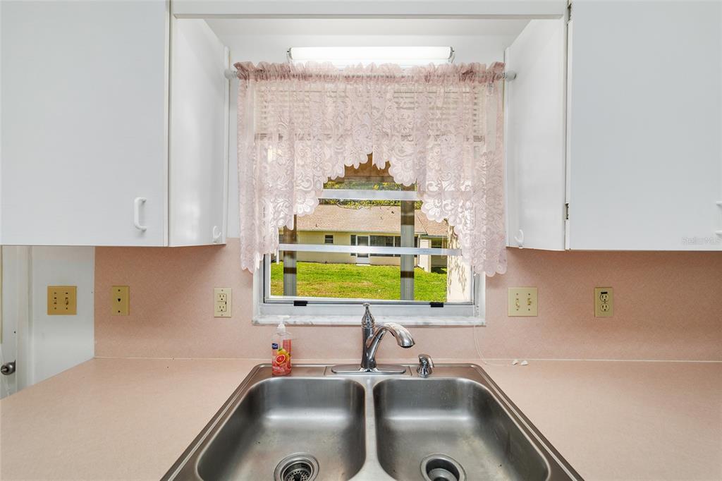 9460 Southwest 84th Terrace, Unit E Ocala, FL 34481 - Photo 10 of 21 a bathroom with a sink and a window