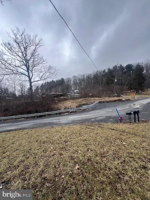 19402 Old Dans Rock Road Southwest Frostburg, MD 21532 - Photo 25 of 25 Serene landscape with winding road ahead.