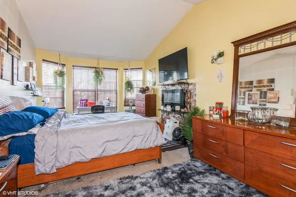 a bed room with a bed and a television