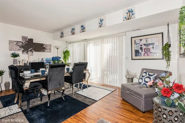 a living room with furniture and flowers