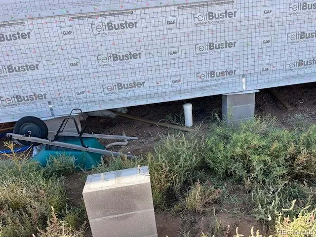 a view of a balcony next to a yard