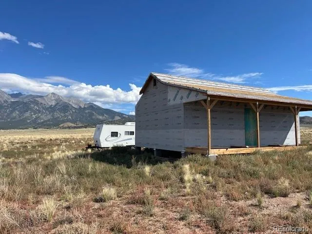 a backyard of house with a large tree