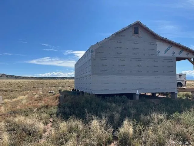 a view of a lake in front of field