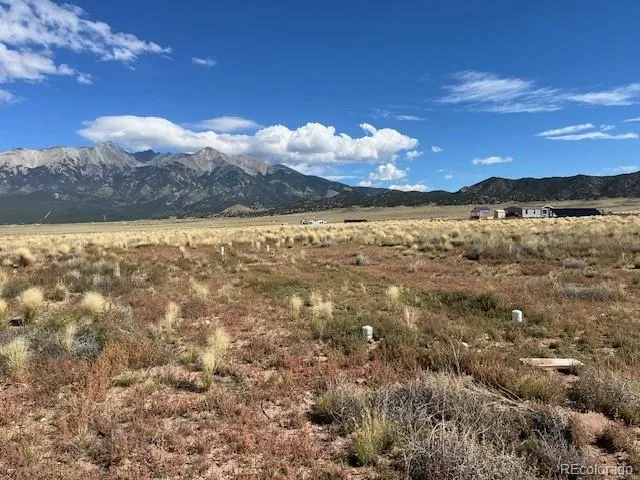 a view of a patio with table and chairs and potted plants