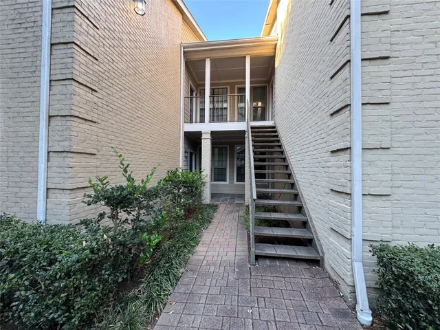 a view of a entryway with flower plants