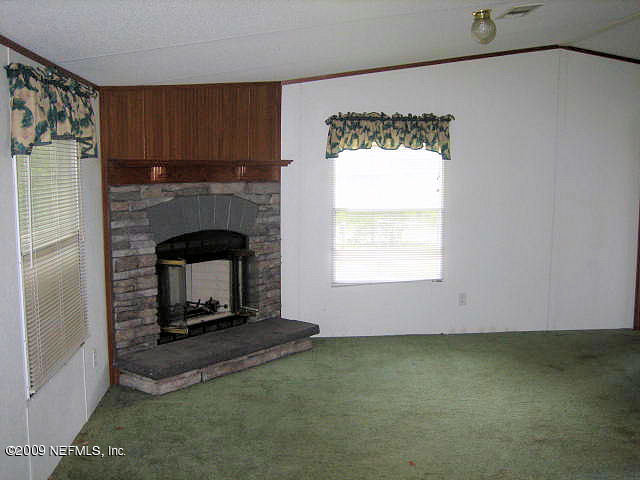 2252 Longreene Road North Jacksonville, FL 32218 - Photo 9 of 14 Family Room and Fireplace