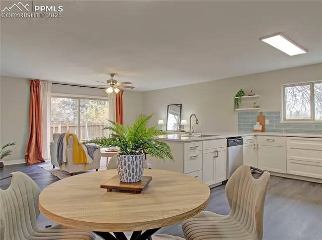 a dining room with furniture and window