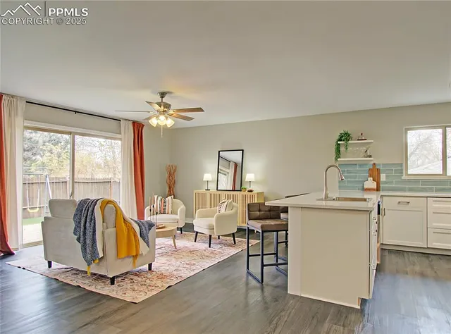 a view of a dining room with furniture window and wooden floor