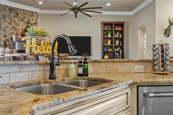 a view of a dining room with furniture a chandelier and wooden floor