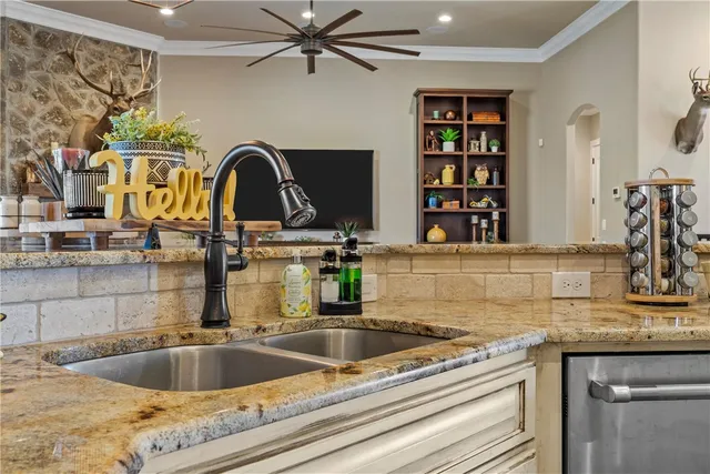 a view of a dining room with furniture a chandelier and wooden floor