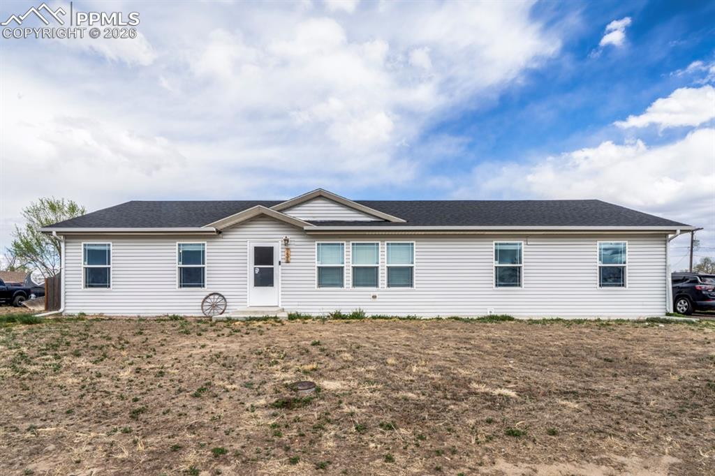 736 Indiana Avenue Limon, CO 80828 - Photo 1 of 37 a front view of house with a garden