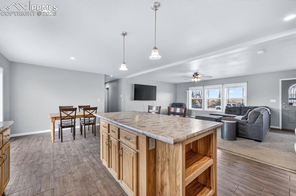 736 Indiana Avenue Limon, CO 80828 - Photo 14 of 37 a view of a dining room with furniture window and wooden floor
