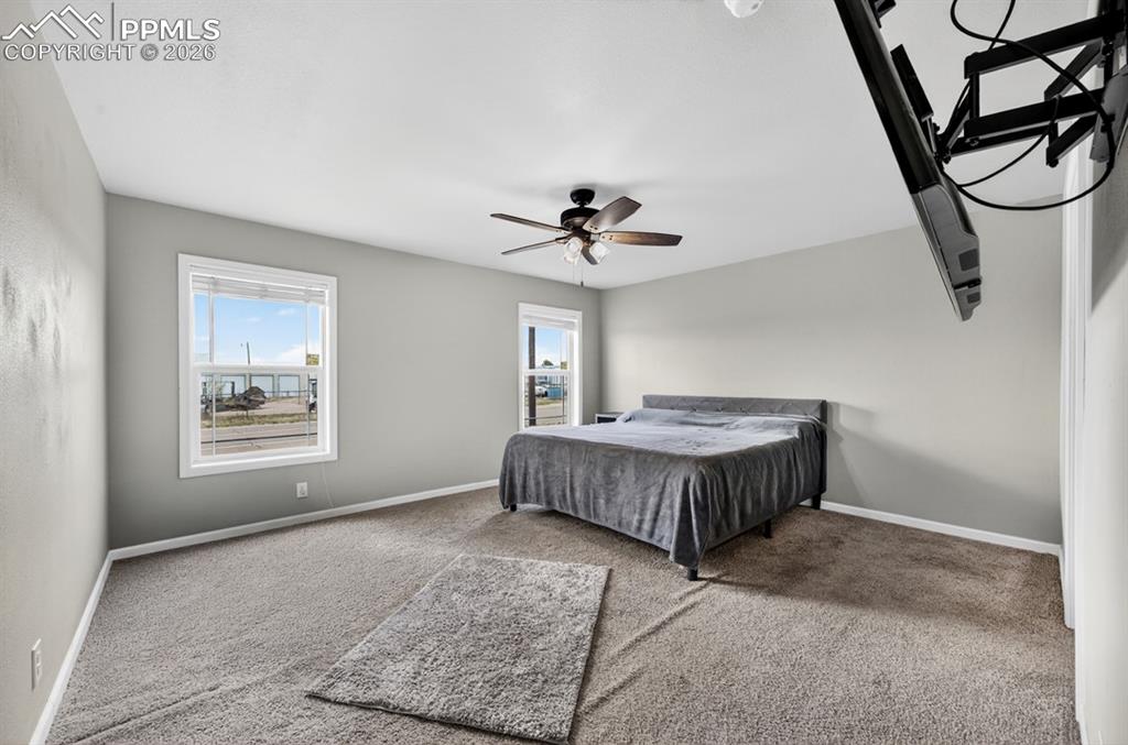 736 Indiana Avenue Limon, CO 80828 - Photo 19 of 37 a living room with a bed furniture and a window
