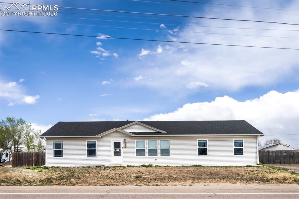 736 Indiana Avenue Limon, CO 80828 - Photo 2 of 37 a front view of a house with a yard