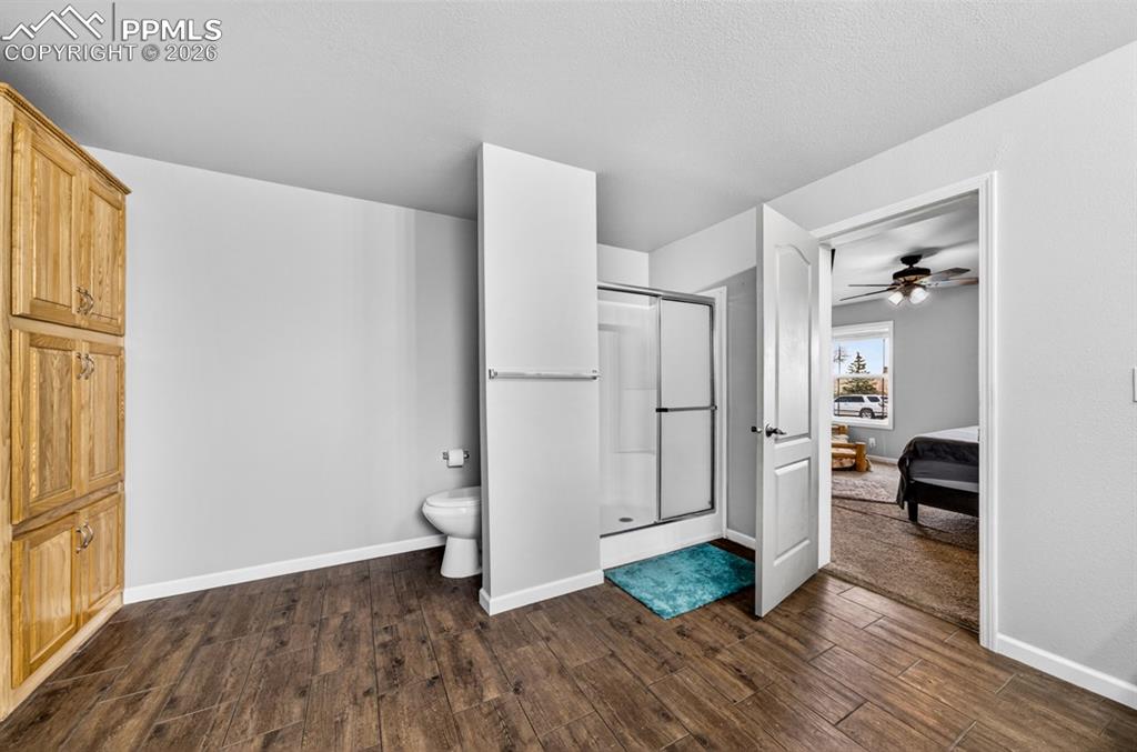 736 Indiana Avenue Limon, CO 80828 - Photo 26 of 37 a view of a livingroom with wooden floor and a refrigerator