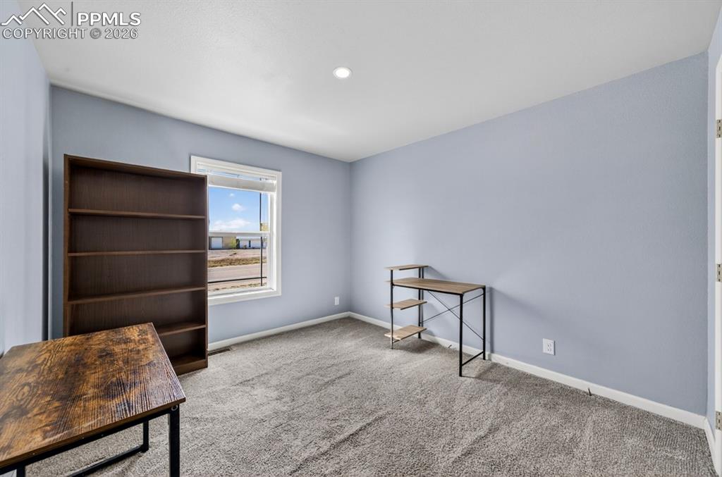 736 Indiana Avenue Limon, CO 80828 - Photo 27 of 37 a view of an empty room and fire place